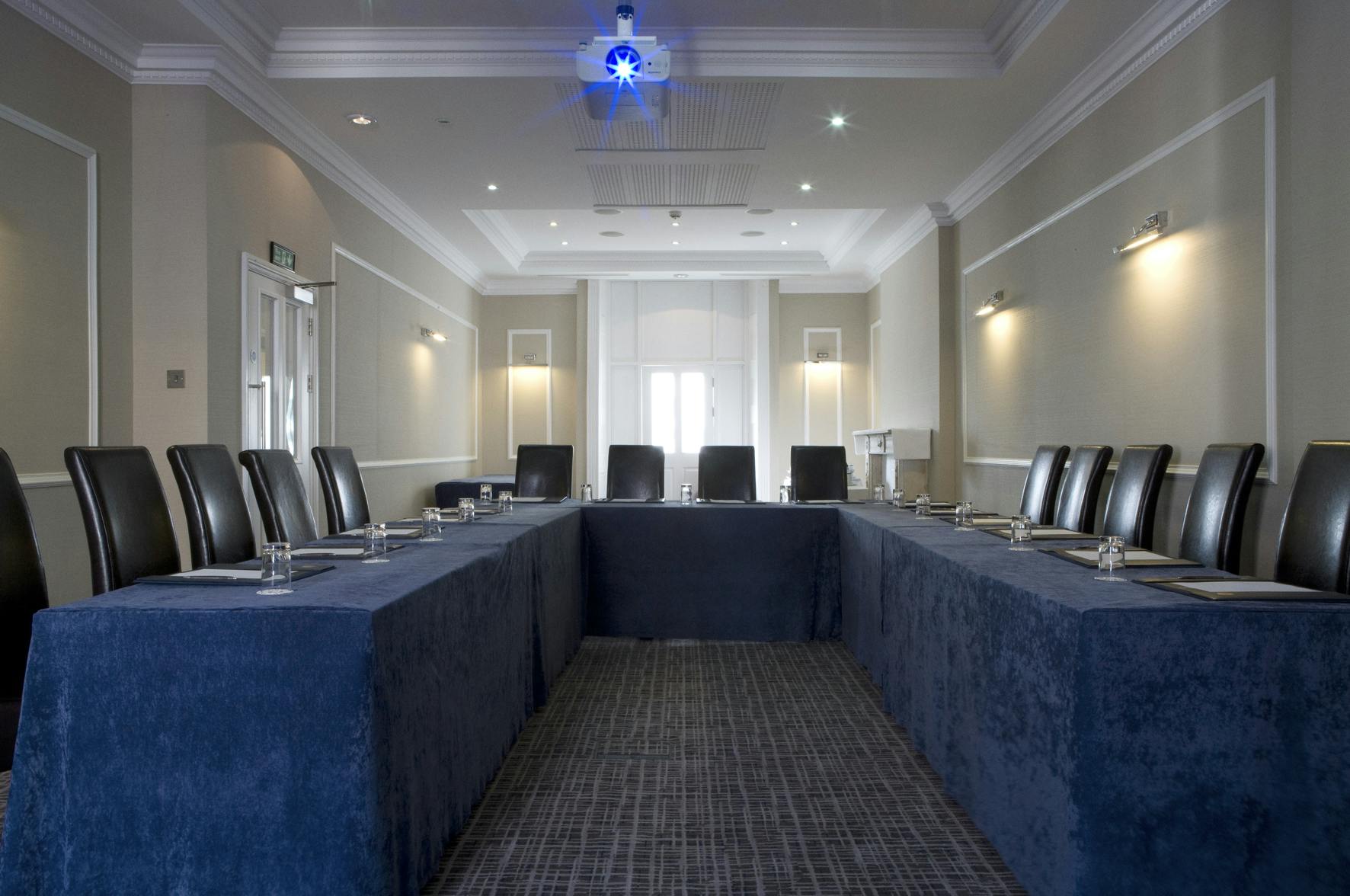 Meeting room at Grange Beauchamp Hotel with U-shaped table for professional gatherings.